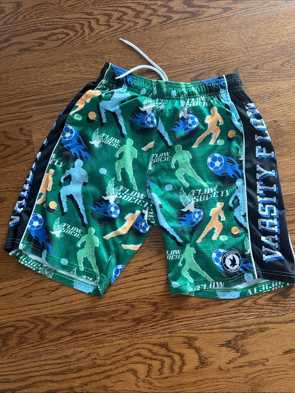 Green Soccer Print Kids Athletic Shorts with Varsity Side Panels FLOW SOCIETY